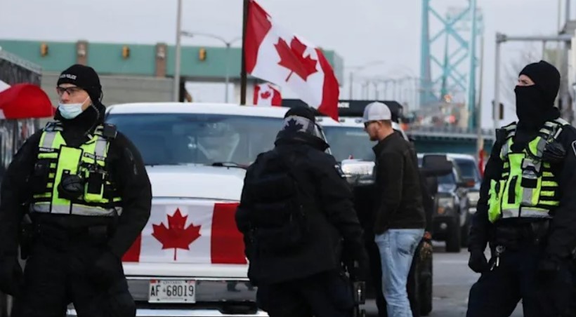 Police started removing the trucker roadblock on Ambassador Bridge